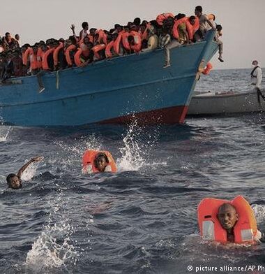 A photograph of a boat full of refugees.